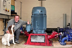 Tim Berry with turbine producing hydropower