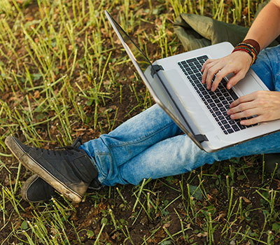 funding - a farmer on a laptop in a field
