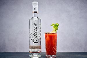 Chase vodka brand with glass of red cocktail