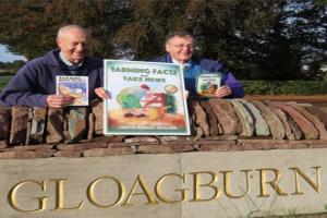 Farmers holding up RSABI farming books